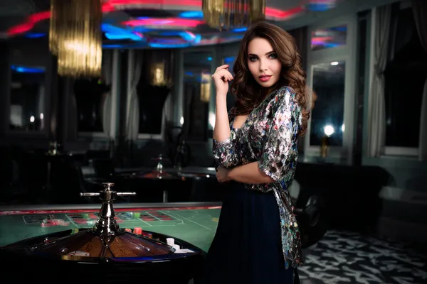 GB44 Jackpot Slots — Spin for massive rewards A dramatic shot of winning sevens landing on a slot reel surrounded by shining gold coins, symbolizing big wins.